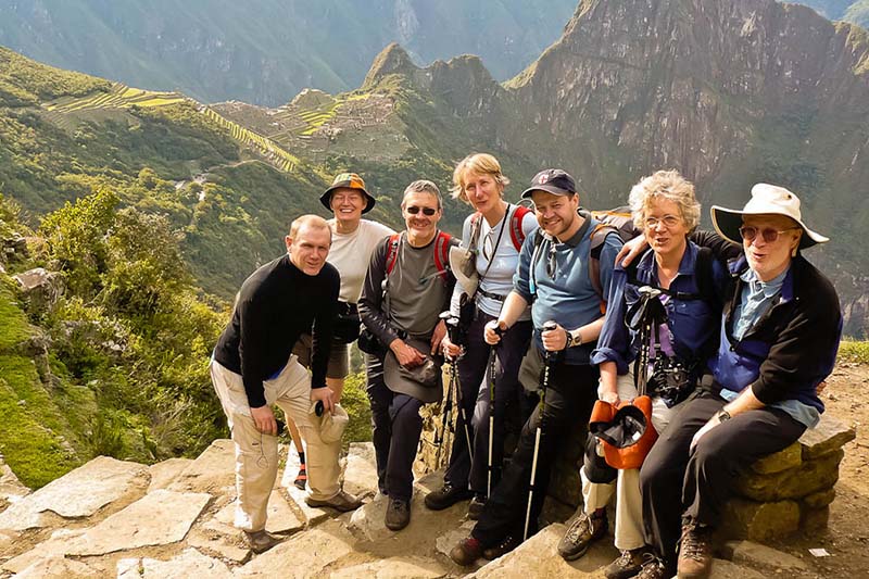 Older adults climbing the mountain Machu Picchu