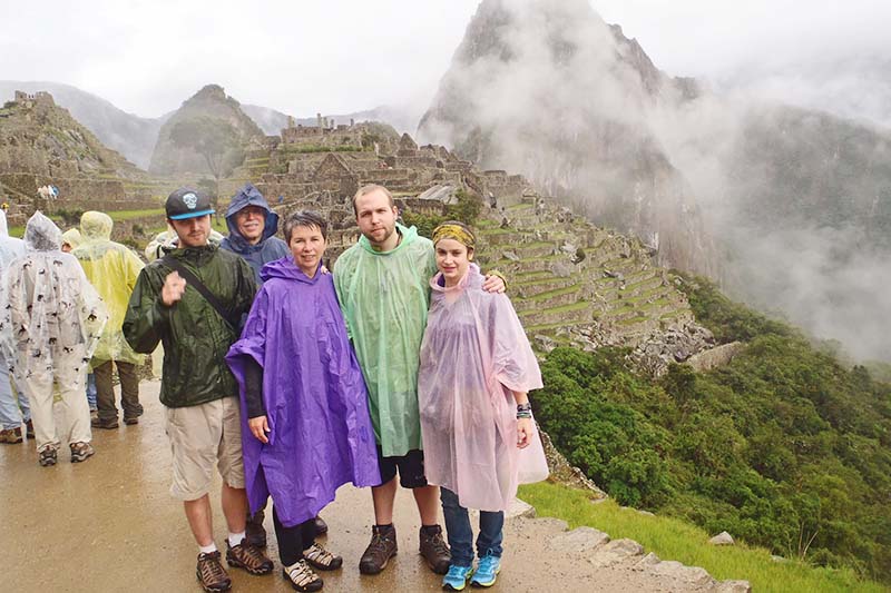 Wet tourists in Machu Picchu