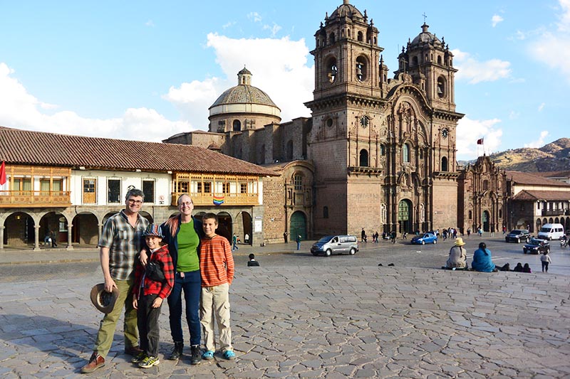 Family with children in the main square of Cusco