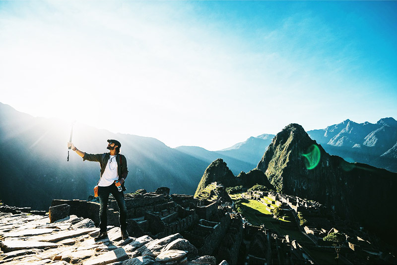 Tourists in Machu Picchu at sunset