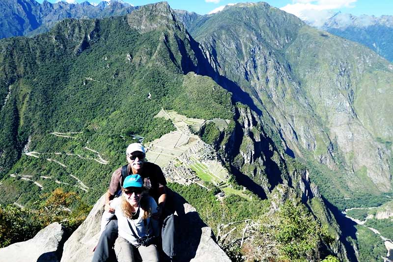 Older adults on the top of the mountain Huayna Picchu