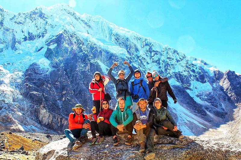 Tourists at the foot of the Salkantay mountain