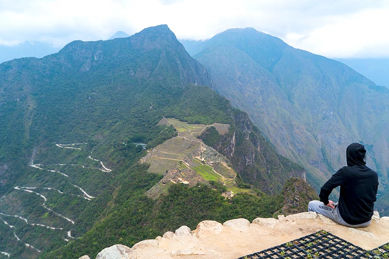 Contemplating Machu Picchu from Huayna Picchu
