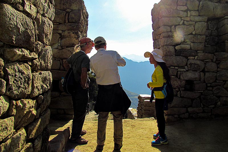 Guide explaining to tourists at Intipunku