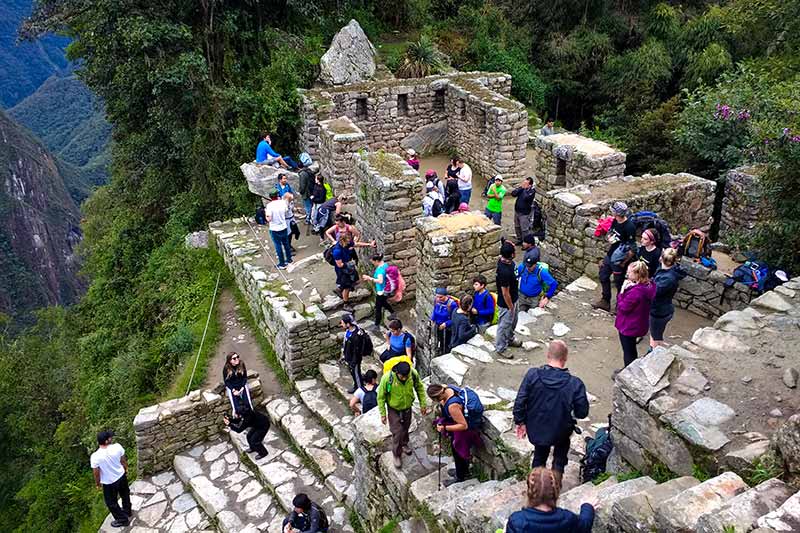 Tourists at the Sun Gate (Intipunku) of Machu Picchu