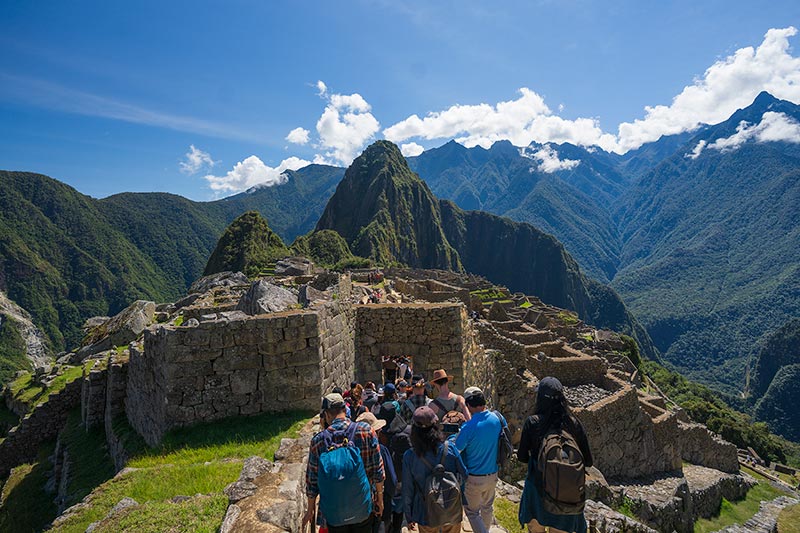 Tourists entering through the main gate of Machu Picchu