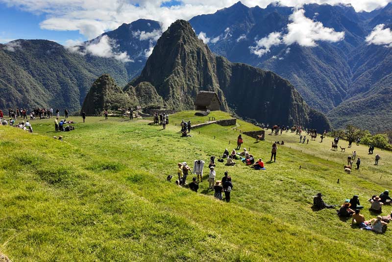 Tourists on the upper terrace of Machu Picchu