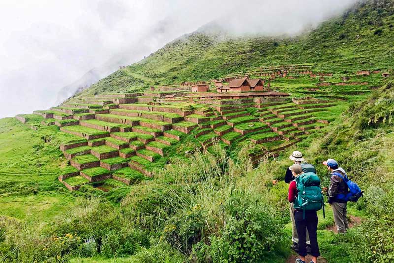 Tourists visiting the archaeological site of Huchuy Qosqo