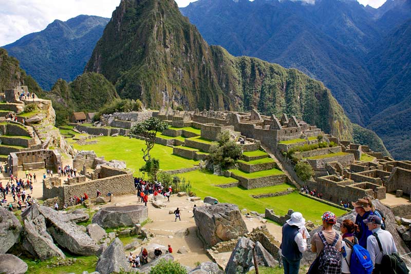 Official guide explaining Machu Picchu to visitors