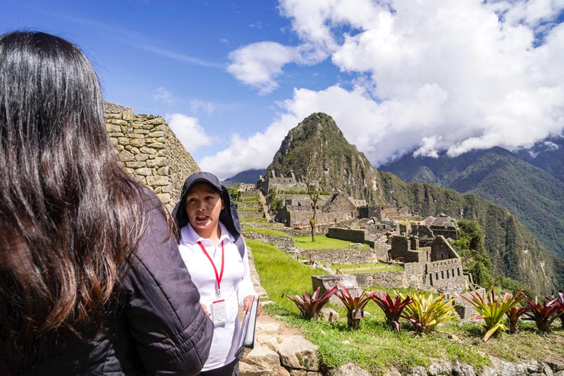 Guide explaining in the Inca citadel of Machu Picchu