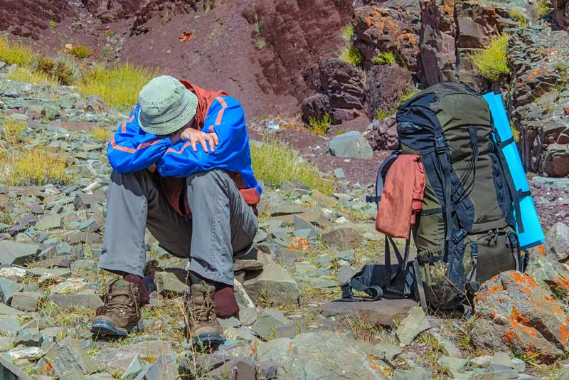 Tourist feeling the effects of altitude sickness