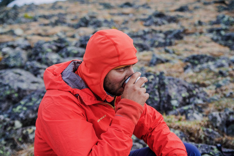 Tourist drinking coca mate to avoid altitude sickness