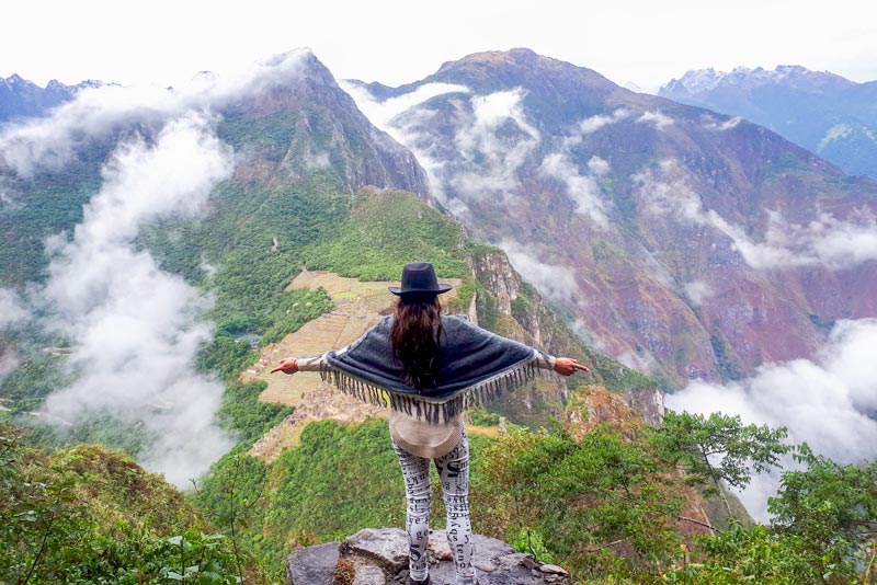 Tourist at the top of Huayna Picchu Mountain