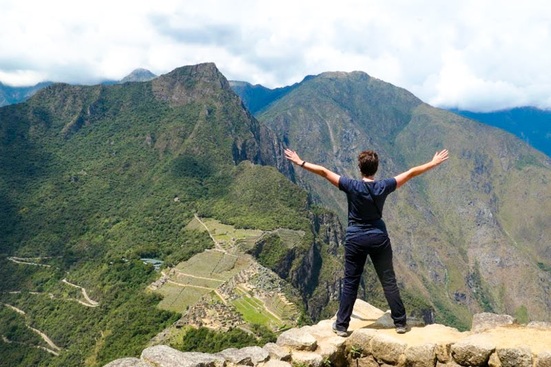 Tourist at the top of Huayna Picchu