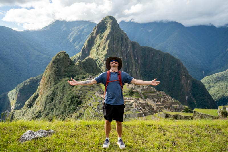 Visitor enjoying his visit to Machu Picchu