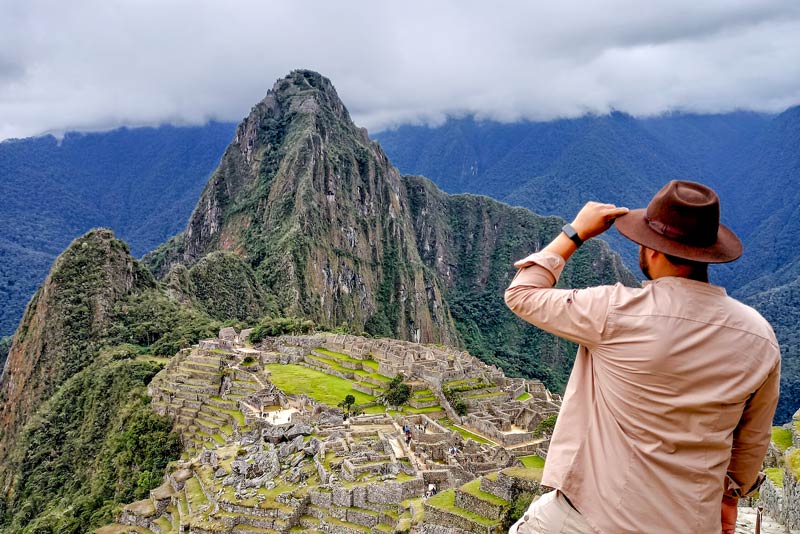 Tourists observing the Inca citadel of Machu Picchu