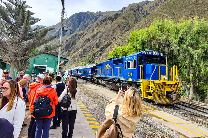 Tourists at Ollantaytambo station waiting for the train