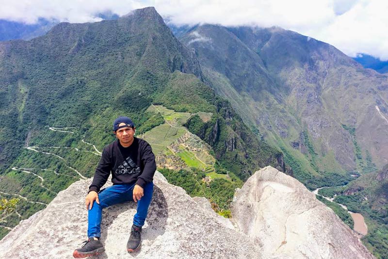 Visitor at the top of Huayna Picchu mountain