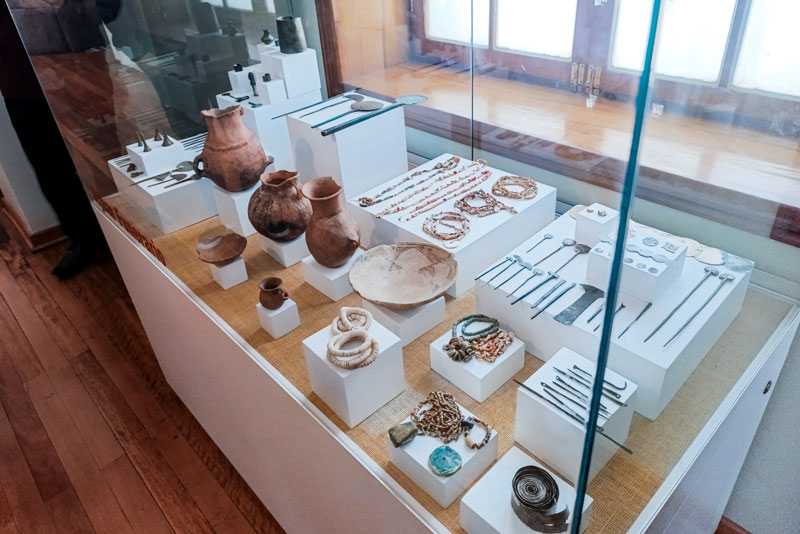 Ancient ceramics and tools displayed in Cusco's museums