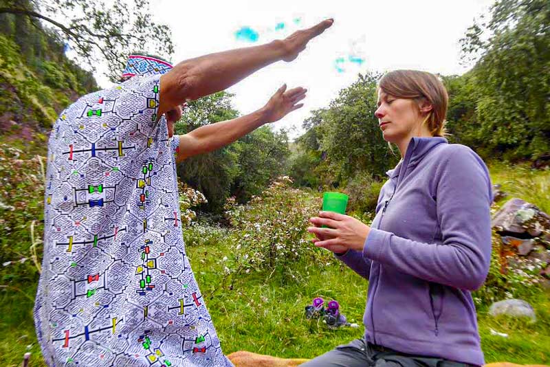 Tourist performing the Ayahuasca ceremony outdoors