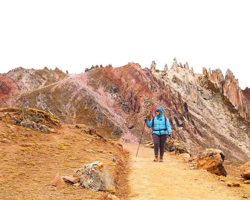 Tourist visiting the rainbow mountain of Palcoyo