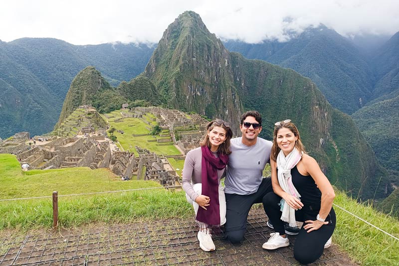 Family of tourists visiting Machu Picchu