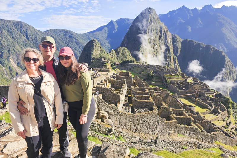 Classic photo of a family of visitors at Machu Picchu