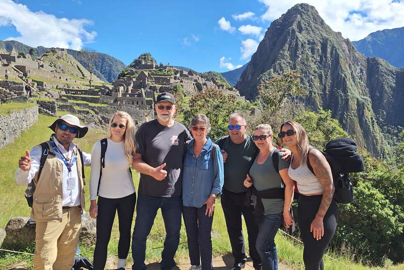 Family of foreign tourists visiting Machu Picchu