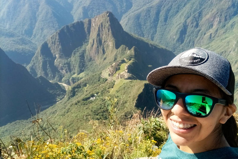 Visitor at the top of Machu Picchu mountain